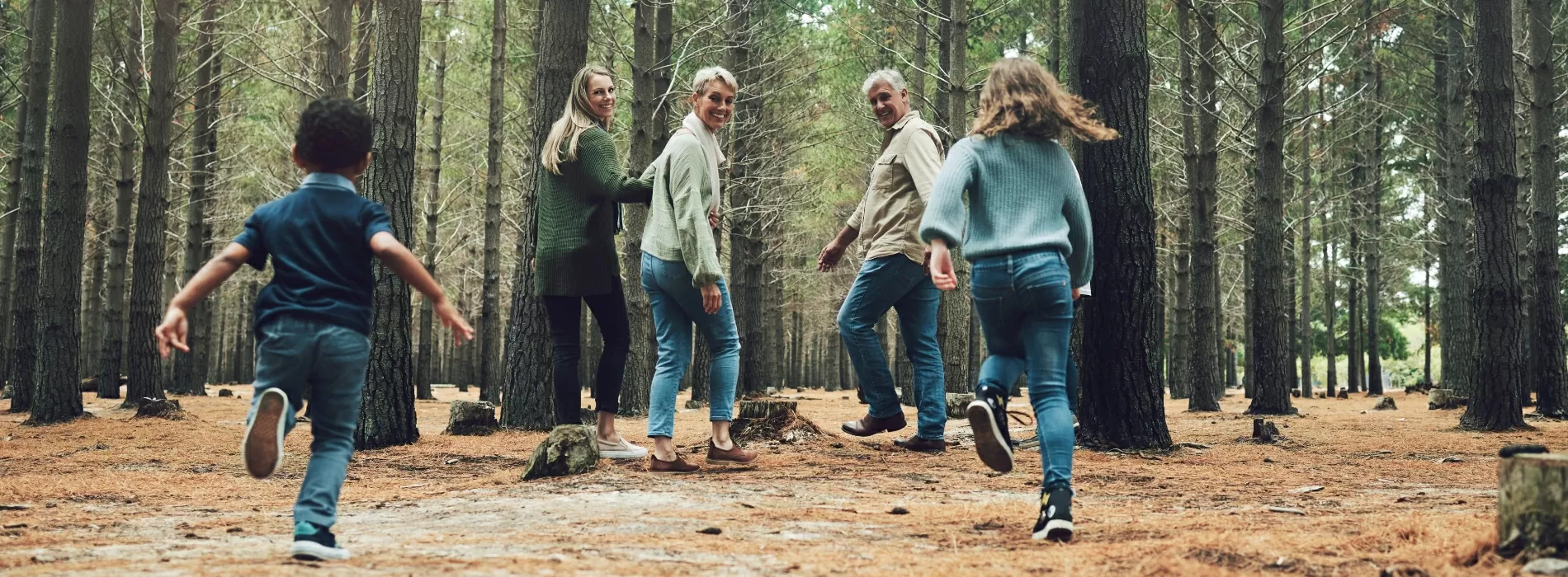 happy family hiking in woods