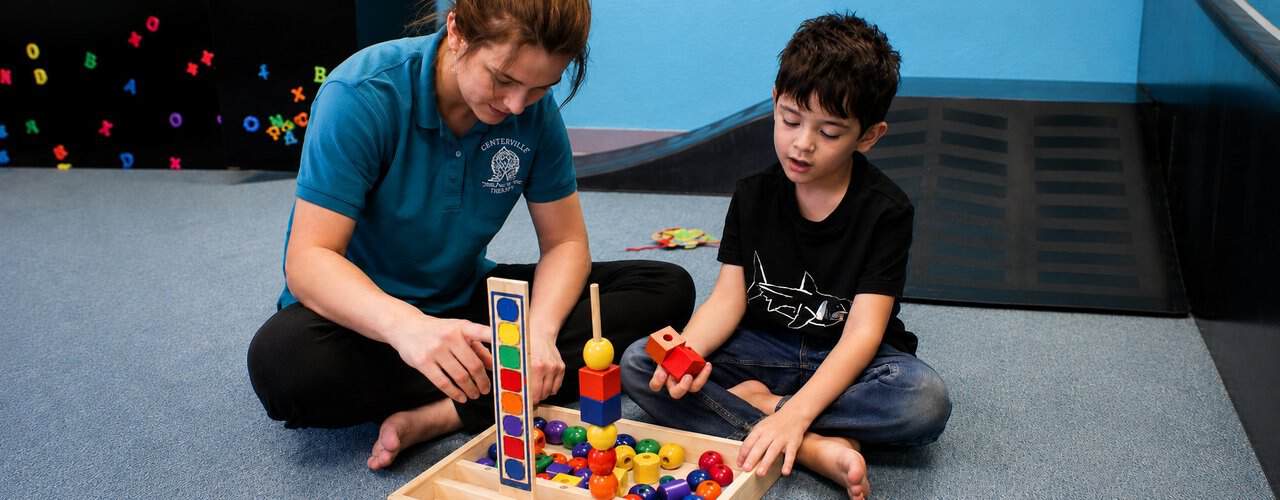 Fine motor delays pediatric occupational therapy at Synergy Therapeutic Group — therapy for grip, handwriting, dressing, and hand-skill development in children in Carbondale, IL